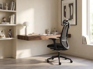 Black OTTUNI Arix ergonomic office chair in a minimalist home workspace with a desk.
