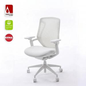 White ergonomic office chair on a white background with the 2025 Platinum A' Design Award, GREENGUARD and BIFMA Compliant badges displayed on the left.