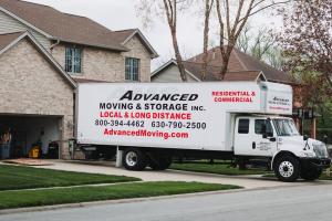 advanced moving & storage's truck parked on driveway