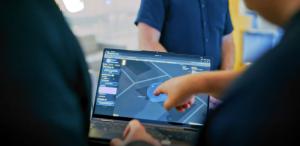 Participants view the Tiami Networks PolyEdge™ sensing interface on a laptop during a joint 5G ISAC field trial with Turkcell.