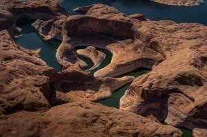 View from above looking down at winding river in Antelope canyon