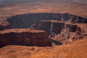 Red rock cliff view of Antelope Canyon River winding between walls