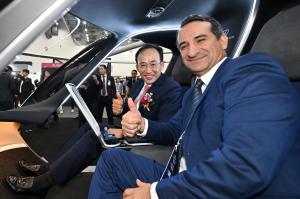 Daegu Mayor Kyung-ho Choo poses with a representative from Volocopter, inside Volocopter's UAM displayed in UAM Experience Zone of FIX 2026
