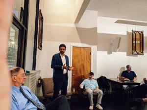 Dr. Joshua Trevino speaking to members of a men's book club in a downtown Chattanooga coffee shop