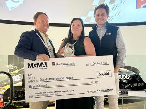 Justin Roof, Jennifer Edelen and 2026 Carolinas MGMA President Jordan Archer hold a check for $3,000 made out to Grand Strand Miracle League for Practice of the Year Award.