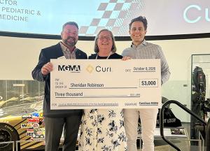 Steve Parker, Sheridan Robinson and 2026 Carolinas MGMA President Jordan Archer hold a check for $3,000 for winning Administrator of the Year.