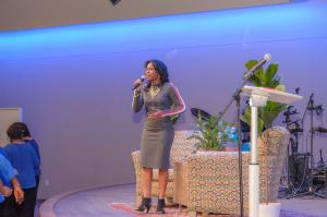 Gospel recording artist Karla Nivens singing during a live musical performance.