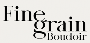 Fine Grain Boudoir logo featuring elegant black serif typography on an off-white background, with “Fine” positioned above “grain” and “Boudoir” beneath.