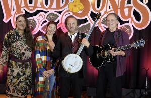 WoodSongs Old Time Radio Hour Episode 1190 Cast (from L to R: announcer Dorothy Edwards, artist Teni Rane, Host Michael Johnathon, artist Claude Carmichael) Photo Courtesy WoodSongs Old-Time Radio Hour