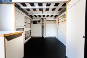 Timber Van Kits Wheel Well Cabinet and Bed System in White