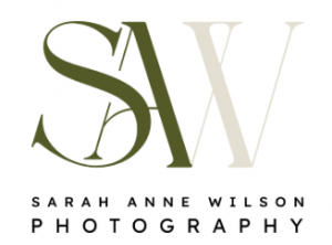 Sarah Anne Wilson Photography logo featuring overlapping “SAW” initials in olive green and cream, with the business name in black uppercase lettering on a white background.