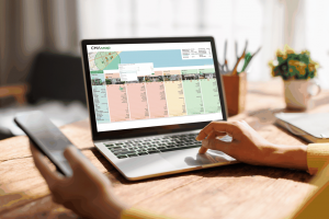 Real estate agent reviewing live comparable market data on a laptop during a client consultation.
