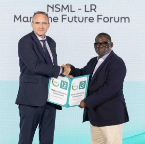 2 men holding a folder and shaking hands