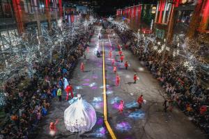 The Bellevue Collection’s Snowflake Lane holiday parade on Bellevue Way NE, steps from Game Show Battle Rooms Seattle – Bellevue at Lincoln Square South. Photo: Chance Merchant Photography..