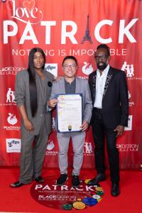 Law Roach, West Hollywood Vice Mayor Danny Hang and Kevan Hall on the red carpet at the "Love, Patrick: Nothing Is Impossible" premiere, with Vice Mayor Hang holding a City of West Hollywood proclamation honoring Patrick Kelly.