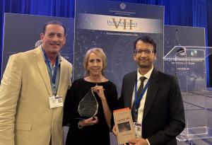 Eddie Kolos, H2Ocean Founder & CEO, and Dr. Rajiv Saini, Chief Scientific Officer, with Annette Leslie, Founder of the Carson Leslie Foundation and 2026 CPRIT Champion Award recipient, discussing sea salt-based oral care and cancer survivorship at the CPRIT Conference