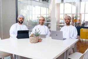 The three Phaze Ventures co-founders seated.