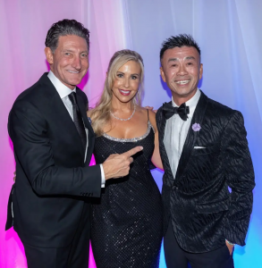 Lead Sponsor David August, Autumn Strier, Co-Founder & CEO of Miracles for Kids, & Quy “Q” Nguyen the 2026 Miracle Maker. Posing for a photo. PHOTO CREDIT: Tom Baker