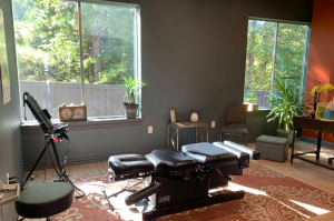 Chiropractic adjusting table in a treatment room at Elite Wellness in Tyler, TX
