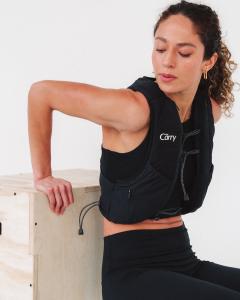 The Carry's launch photoshoot featuring a female athlete using The Carry Weighted Vest for training