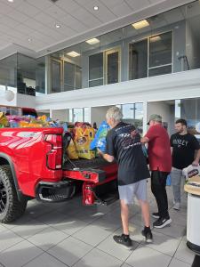 Reno Corvette Club members load pet food donations at Michael Hohl Chevrolet in Carson City, Nev., on Oct. 3, 2026, in support of Feeding Pets of the Homeless' annual Fill a Vehicle campaign.