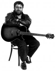 Harry Pepl, Austrian jazz guitarist, studio portrait with acoustic guitar