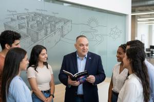 Dr. Mathias Kunze pictured with a group of students.