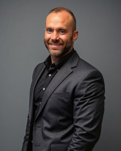 Photo of Counsel Evan Carson, served with the U.S. Army Reserve & National Guard