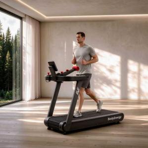 Users running on the motor-free BodyEnergy Ab-Drive treadmill with natural stride propulsion.