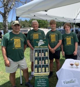Dolan Flavoring Family Members as a Farmers Market with Signage and Display box