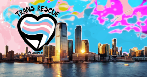 Trans Rescue Action rising behind the Jersey City skyline with with the river, and the sky is a mixture of paint splatter pink, blue, purple, and yellow.