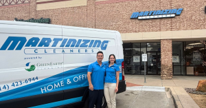 Martinizing Cleaners Frisco, TX franchise owners Luis Gerardo Treviño Morales and Viviana Deschamps Guerra standing beside a branded Martinizing Cleaners pickup and delivery van outside their location in Frisco, Texas.