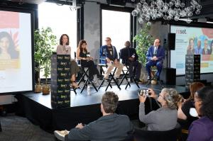 Five panelists seated on stage before an audience at The Impact Lounge during NYC Climate Week