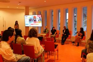 Panelists seated in a row in front of an audience at the Columbia Climate School screening event