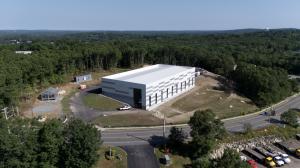 30,000 square foot factory with a light gauge steel framed home model on the side, this location is where MassDwell ADUs will be built