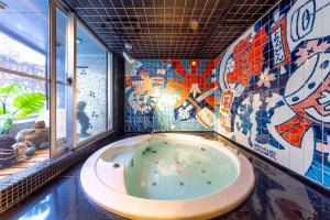 The private jacuzzi at Andon Ryokan, decorated with tiles hand-painted at an Arita porcelain workshop