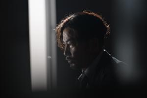  Simon Yam as the Chief Inspector in Mastermind (2026), a Hong Kong neo-noir crime thriller directed by James L.J. Hung, exploring police corruption and institutional conspiracy.