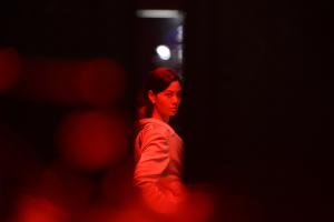 Amy Lo as a forensic pathologist in Mastermind (2026), a Hong Kong neo-noir crime thriller directed by James L.J. Hung, featuring a complex murder investigation and police conspiracy.