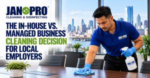A uniformed JAN-PRO Cleaning & Disinfecting professional cleaning a conference room table in a modern Northern New Jersey office, with the New York City skyline in the background, illustrating managed business cleaning services as an alternative to in-hou