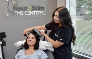 Woman during TMS Therapy treatment for depression in NeuroStim TMS Woodbury clinic