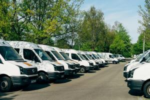 A fleet of commercial vehicles parked together.