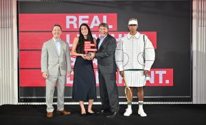 Tal Zohar receives the RLSD 2026 International Student Design Competition award in Bangkok, alongside Kerry Brozyna, U.S. Ambassador Sean Kotaro O’Neill and a model wearing her winning leather tennis-inspired outfit.