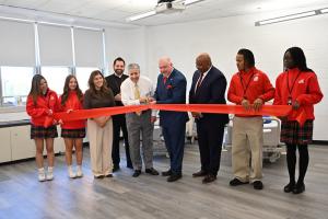 Saint Elizabeth University and St. Thomas Aquinas High School representatives and students cut the ribbon on a new Clinical Skills Lab in Edison, New Jersey.