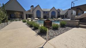 Sign outside of house displaying HYVE as a trusted option among Home Security Companies Lehi