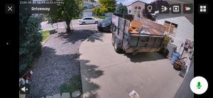 screen capture showing a live security camera feed of a driveway in Lehi.