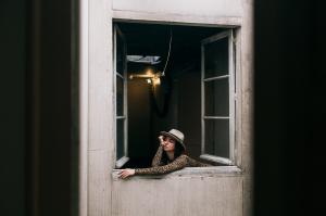 Bored woman looking out of window