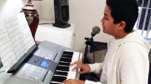 13 year old Alberto Nequiz sings and plays the piano for a virtual audience.