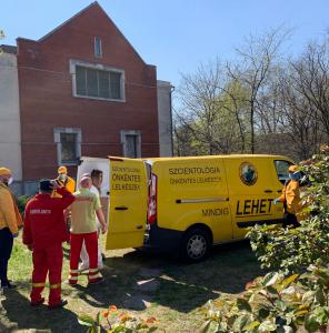 Ambulance workers help unload the gifts from the Volunteer Ministers' van.