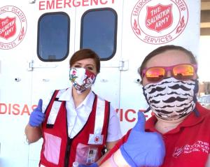 Two ladies from the Salvation Army with donated masks to keep them safe