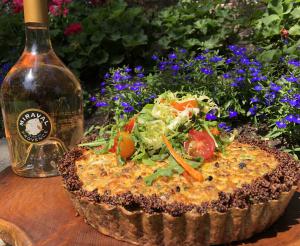 TRIBUTE'S Jumbo Lump Crab & Gruyere Quiche and a Bottle of Miraval Rose couple well with a gift certificate to Solaya Spa and Salon.